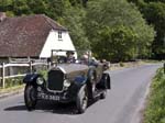A Vintage Humber Tourer Car passing Burton Mill